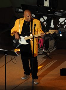 Eddie Watkins Jr playing guitar on stage